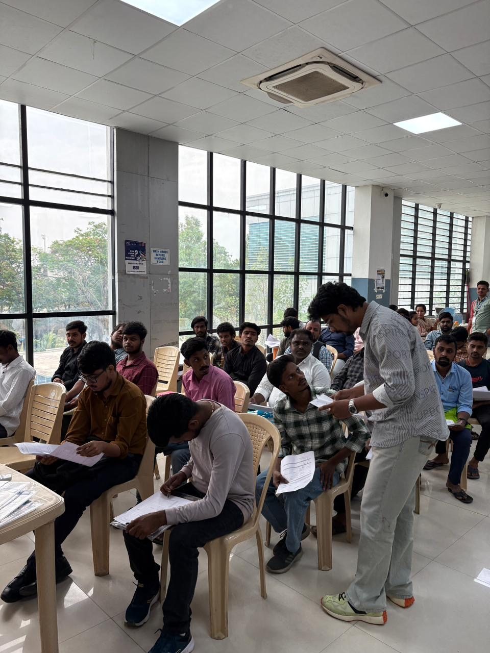 Candidates complete their written assessment